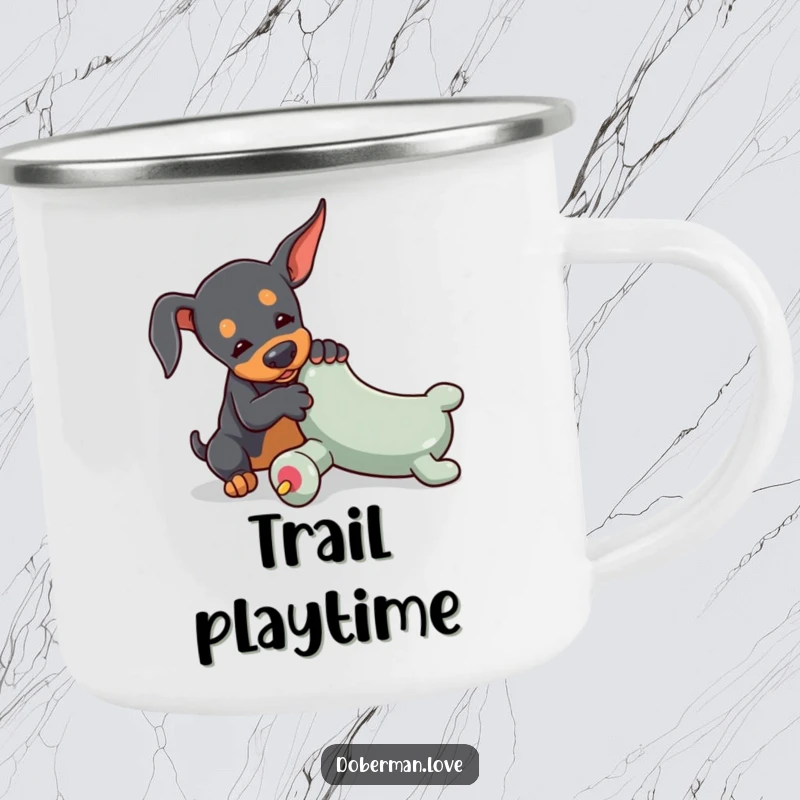 Funny Doberman camping mug featuring a tiny dog playfully wrestling with an oversized toy chew, perfect for enjoying drinks outdoors.