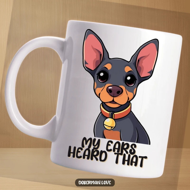 Funny Kawaii Doberman Mug with a tiny bell collar, looking curiously at the viewer, perfect for dog lovers.
