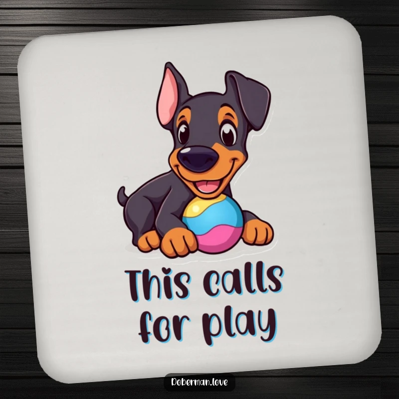 Funny Doberman Coaster: Cheerful dog nudging a colorful toy, a humorous coaster for surface protection.