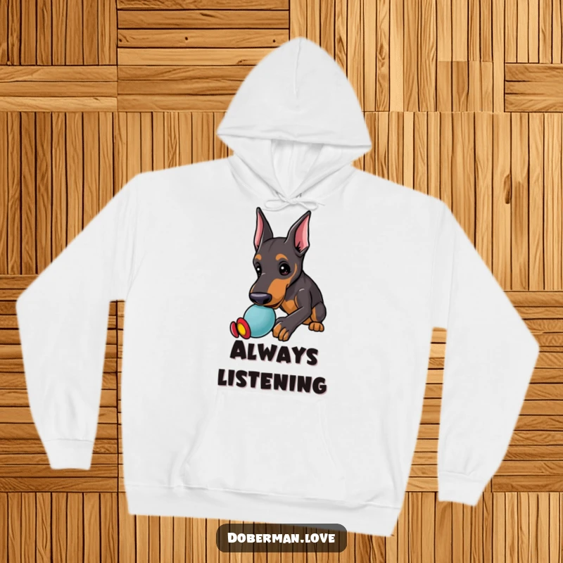 Funny Doberman Hoodie featuring a kawaii doberman puppy with alert ears, playfully nudging a toy, offering warmth and fun.