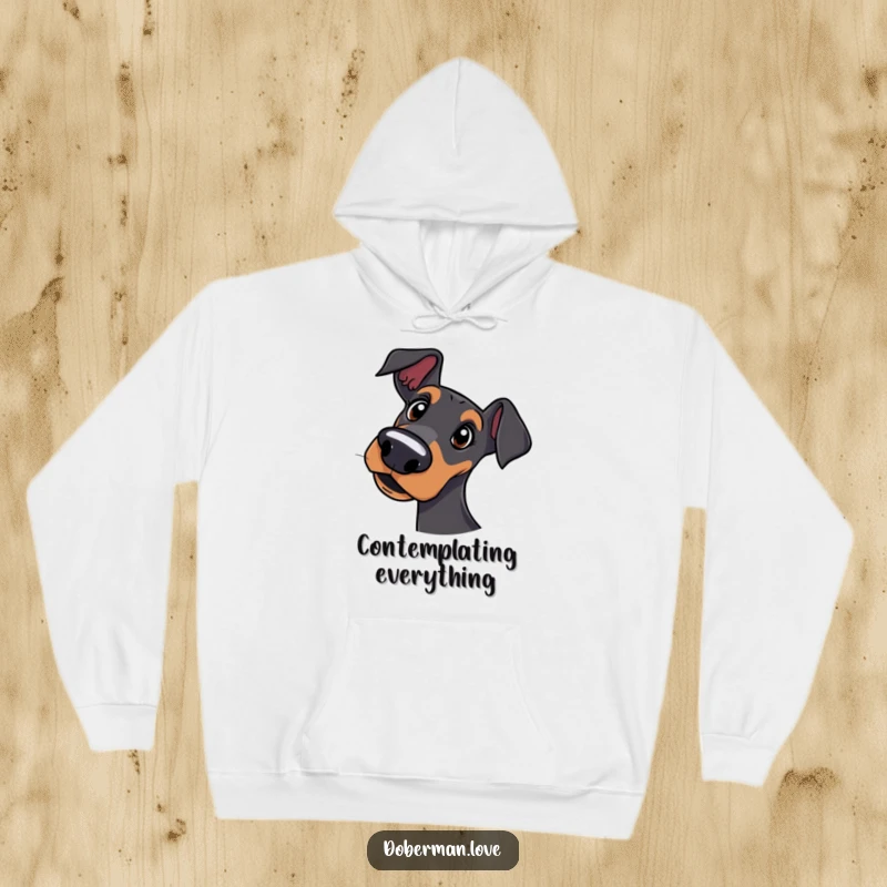 Funny hoodie depicting a Doberman dog tilting its head in a questioning and endearing manner.