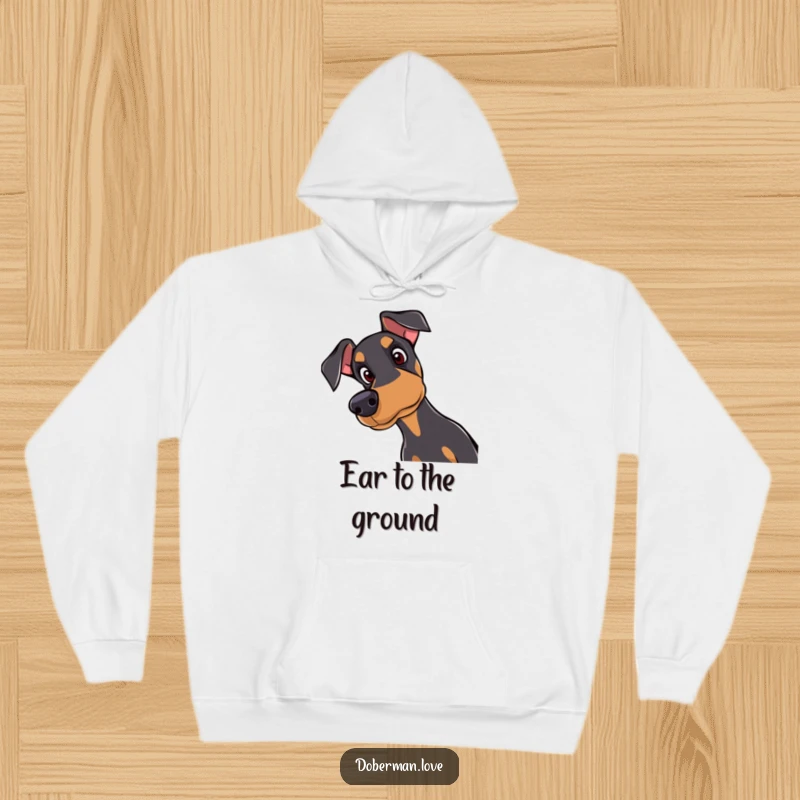 Funny Doberman hoodie featuring a curious dog tilting its head with attentive eyes, offering warmth and a touch of endearing humor.