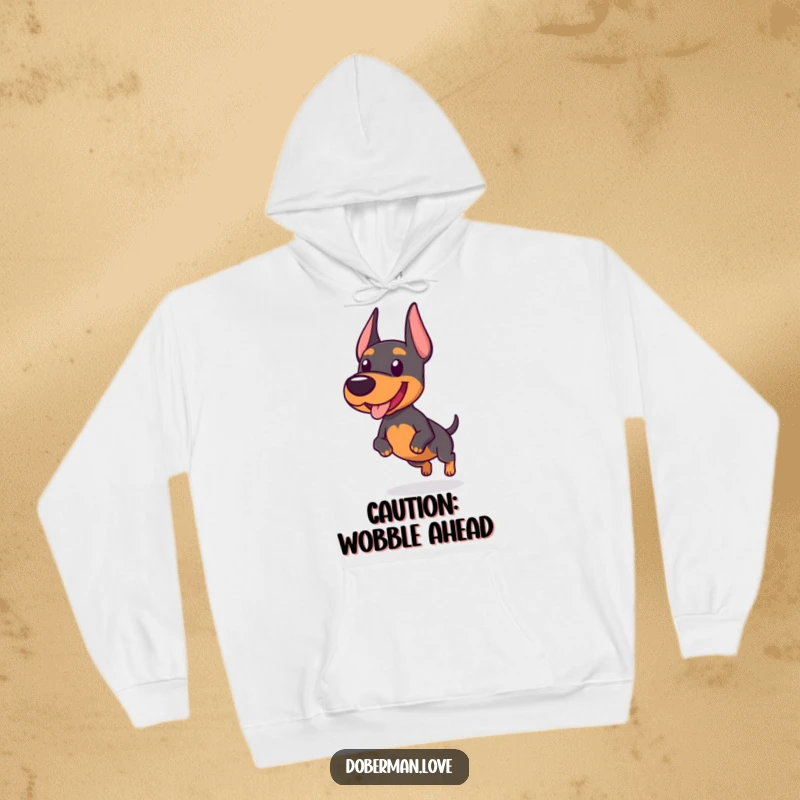 Funny hoodie featuring a chubby Doberman dog enthusiastically trotting with a wobbly gait, showcasing pure, uninhibited happiness.