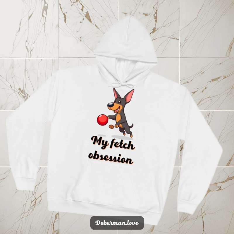 Funny Doberman Hoodie: Playful Doberman leaping to catch a red ball, comfortable and humorous hooded sweatshirt for active dog lovers.