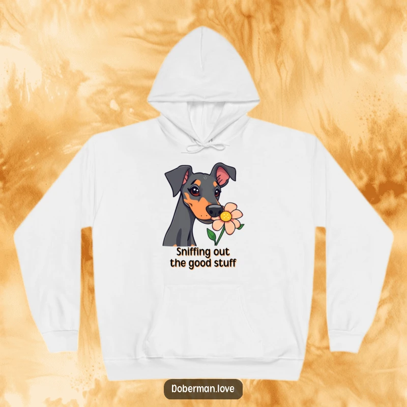 Funny doberman hoodie featuring a curious dog intensely sniffing a bright flower, capturing a moment of delightful canine investigation.