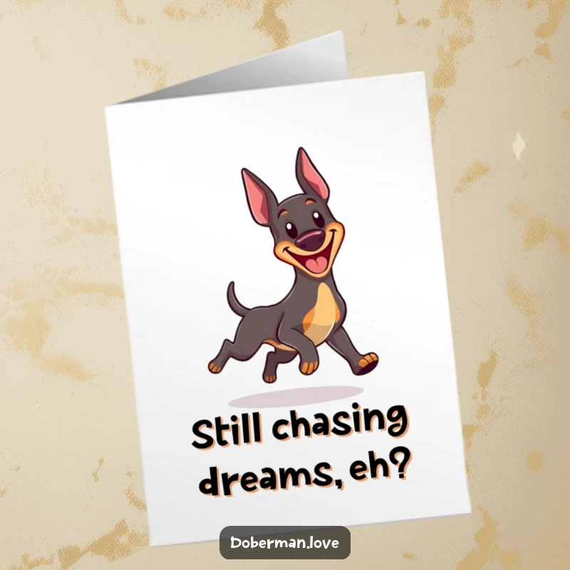 Funny Free Printable Birthday Card: Kawaii Doberman joyfully spinning in circles, chasing its tail with a big grin.