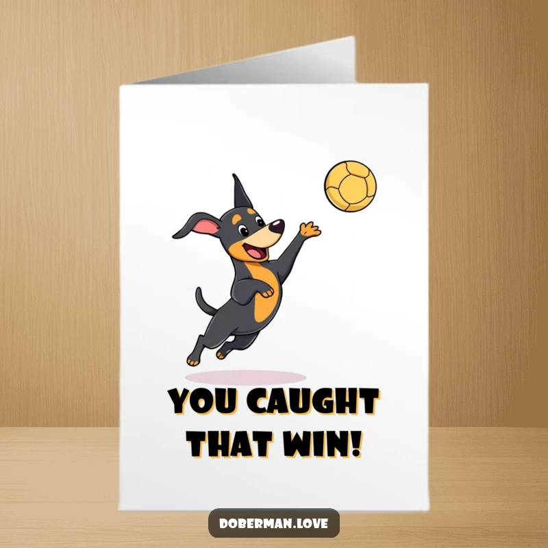 Funny Free Printable Congratulations Card featuring a cute kawaii doberman leaping playfully to catch a thrown ball.