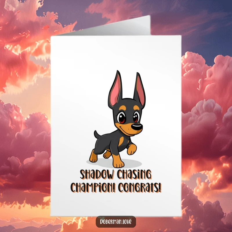 Funny free printable congratulations card showing a determined Doberman catching its elusive shadow, symbolizing achievement.