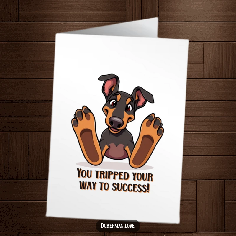 Funny Free Printable Congratulations Card: Silly Doberman tripping, symbolizing overcoming challenges with humorous grace.