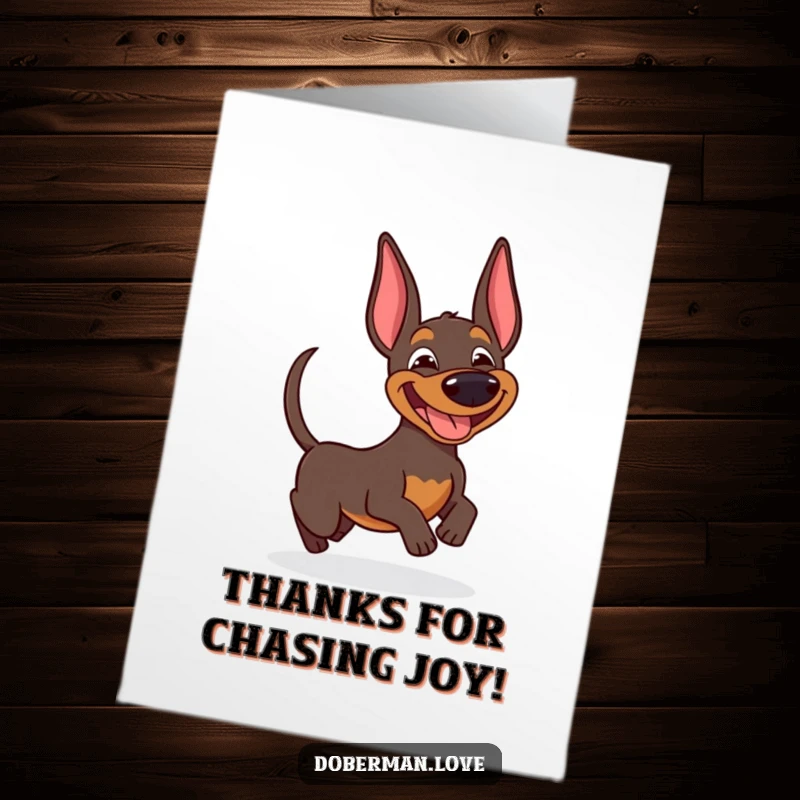 Funny Free Printable Thank You Card: A happy doberman mid-spin, chasing its tail with a goofy, grateful expression.