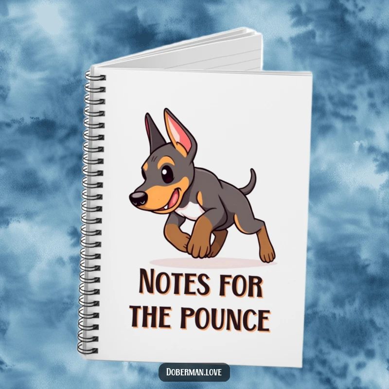 Funny Doberman puppy notebook with an energetic puppy in a determined pounce, perfect for jotting down plans with focus and playful intent.