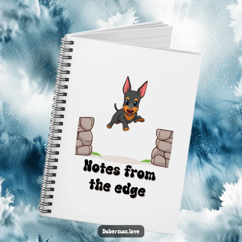 Funny notebook cover showing a small Doberman puppy attempting a wobbly jump, designed to inspire cheerful thoughts and creativity.