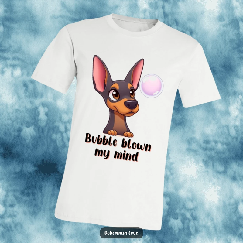 Funny Doberman T-Shirt: Surprised dog with innocent eyes mesmerized by a floating bubble, charmingly funny.