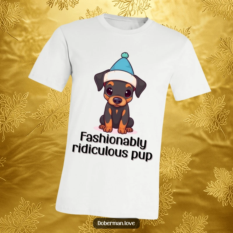 Funny t-shirt displaying a Doberman puppy comically trying to wear a much too small hat, full of puppy charm.