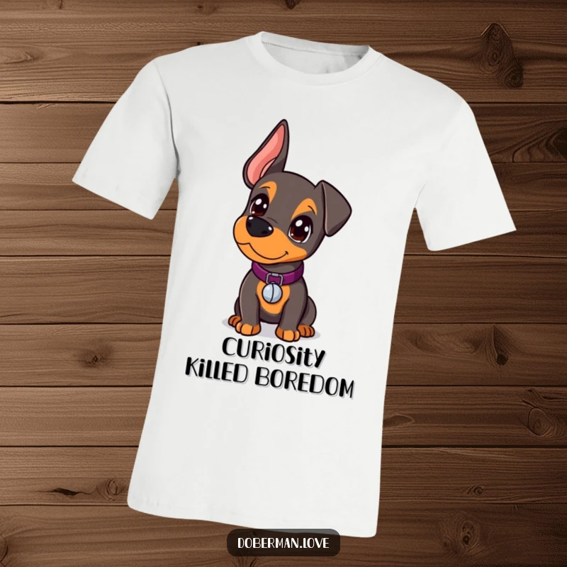 Funny Doberman T-Shirt with a kawaii doberman puppy looking curiously, wearing a cute tiny collar with a jangly bell.