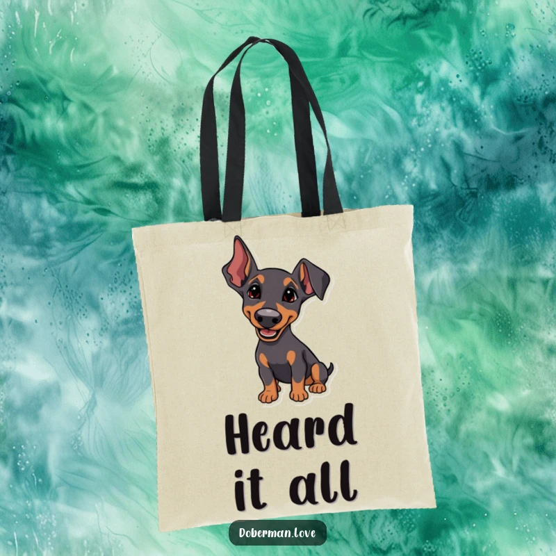 Funny Tote Bag with a Doberman whose ears are perked, listening intently with a happy tilt, perfect for carrying essentials.