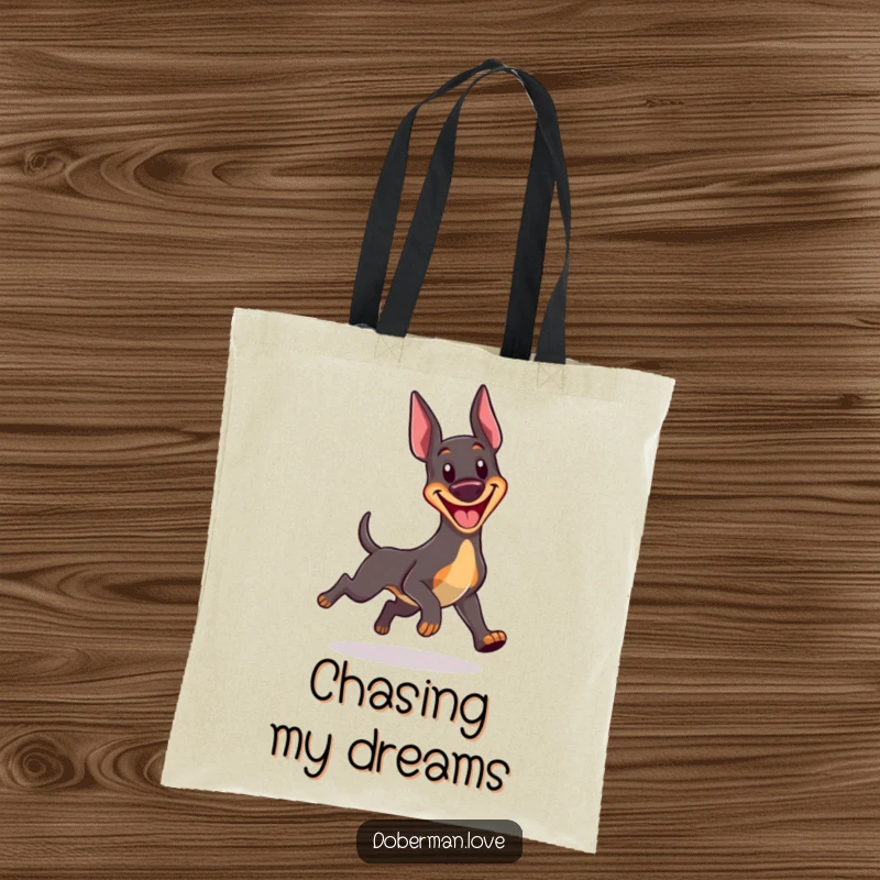Funny Kawaii Doberman tote bag showcasing a happy dog with a huge grin, comically chasing its own tail, practical and amusing.