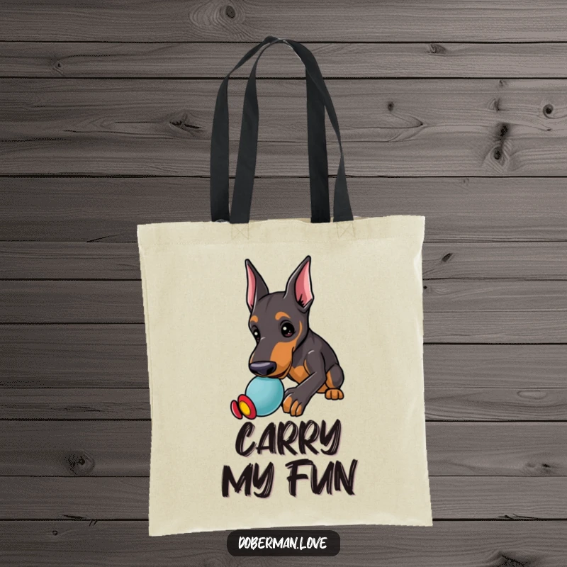 Funny Doberman Tote Bag showcasing a kawaii doberman puppy with alert ears, playfully nudging a toy, ready for action.