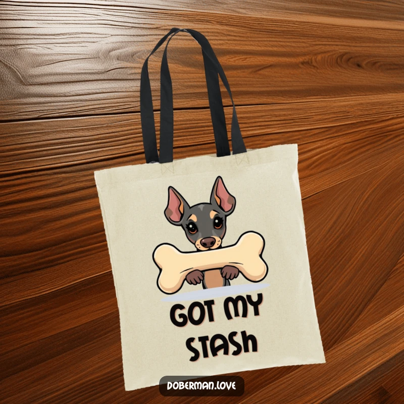 Funny Kawaii Doberman tote bag showing a dog peeking from behind a large bone, a stylish and humorous accessory for daily use.