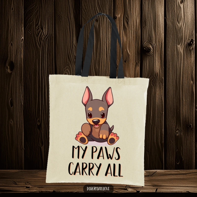 Funny Doberman Tote Bag showcasing a kawaii doberman puppy with huge paws, joyfully engaged in play, ready to carry your stuff.